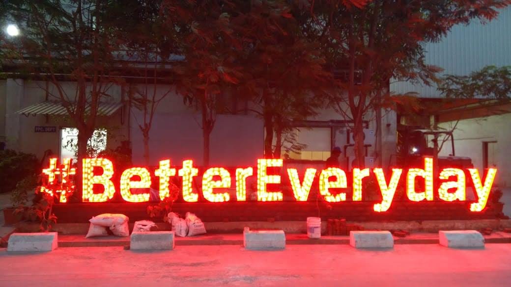 The #BetterEveryday lit sign at a BRIGS customer site at night